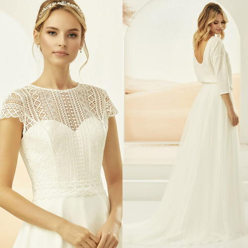 Frau trägt ein Mix and Match Hochzeitskleider mit separatem Spitzenbolero und Brautrock